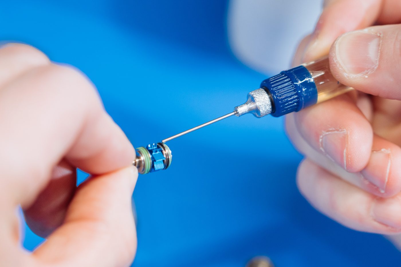 Close-up of handpiece components being inspected